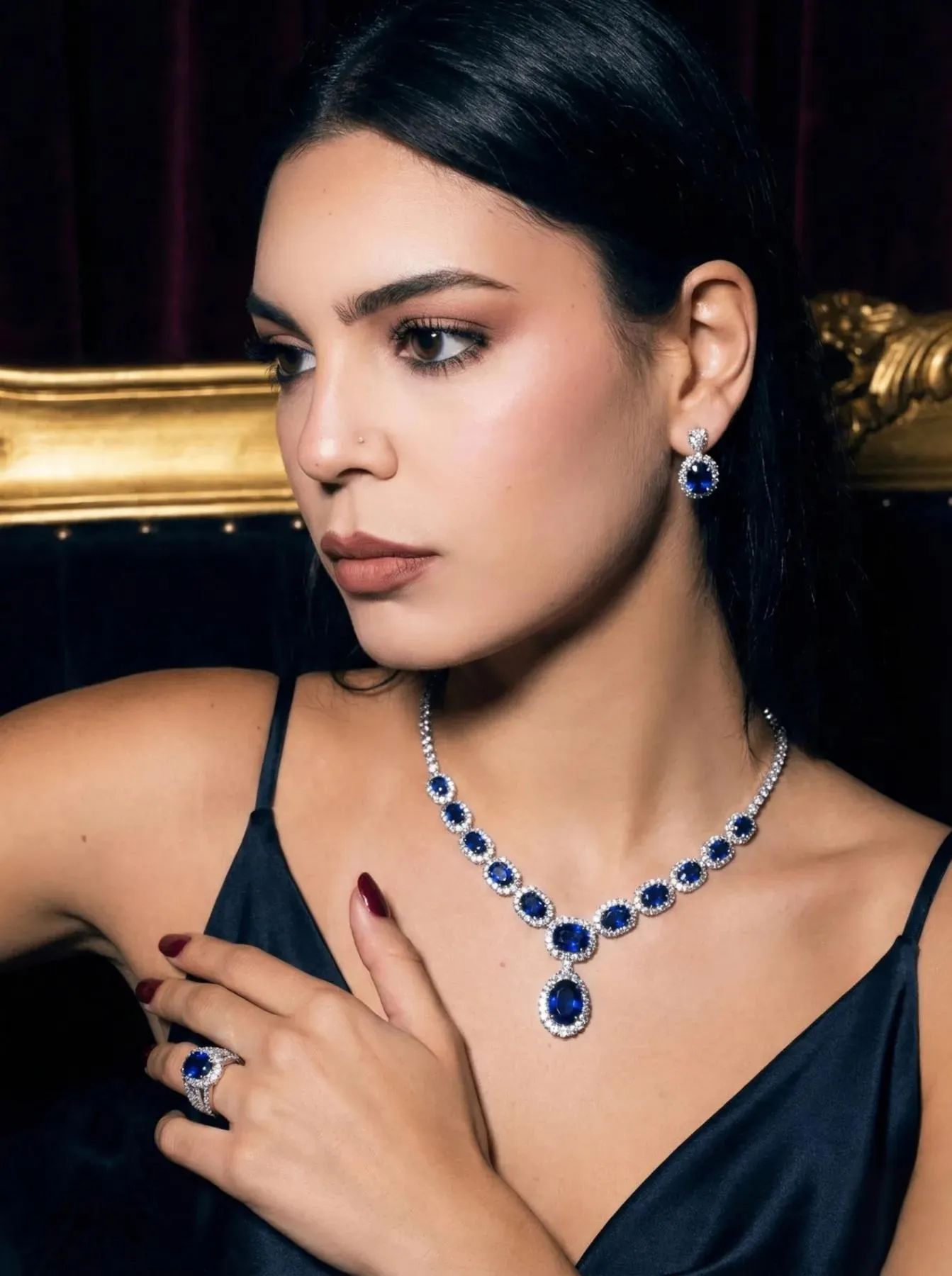 Model wearing a sapphire necklace set
